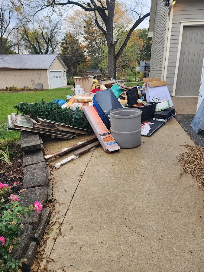 Dumpster being loaded with debris for 3 Yard Dumpster Rental in Caledonia